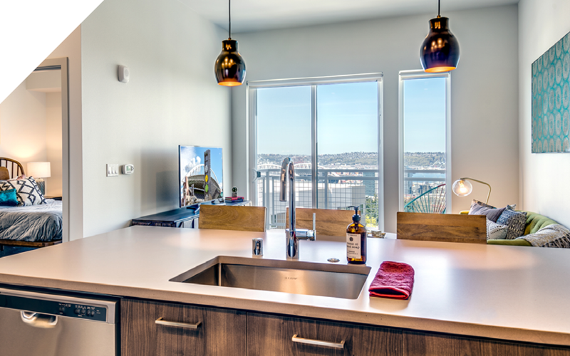 a kitchen overlooking living room