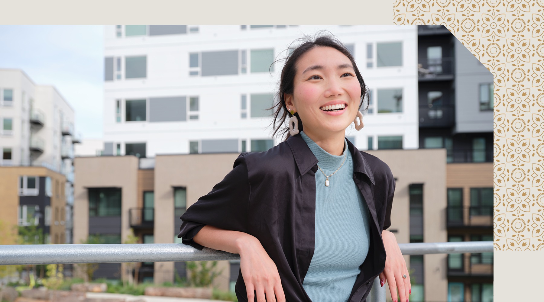 a woman smiling outdoors